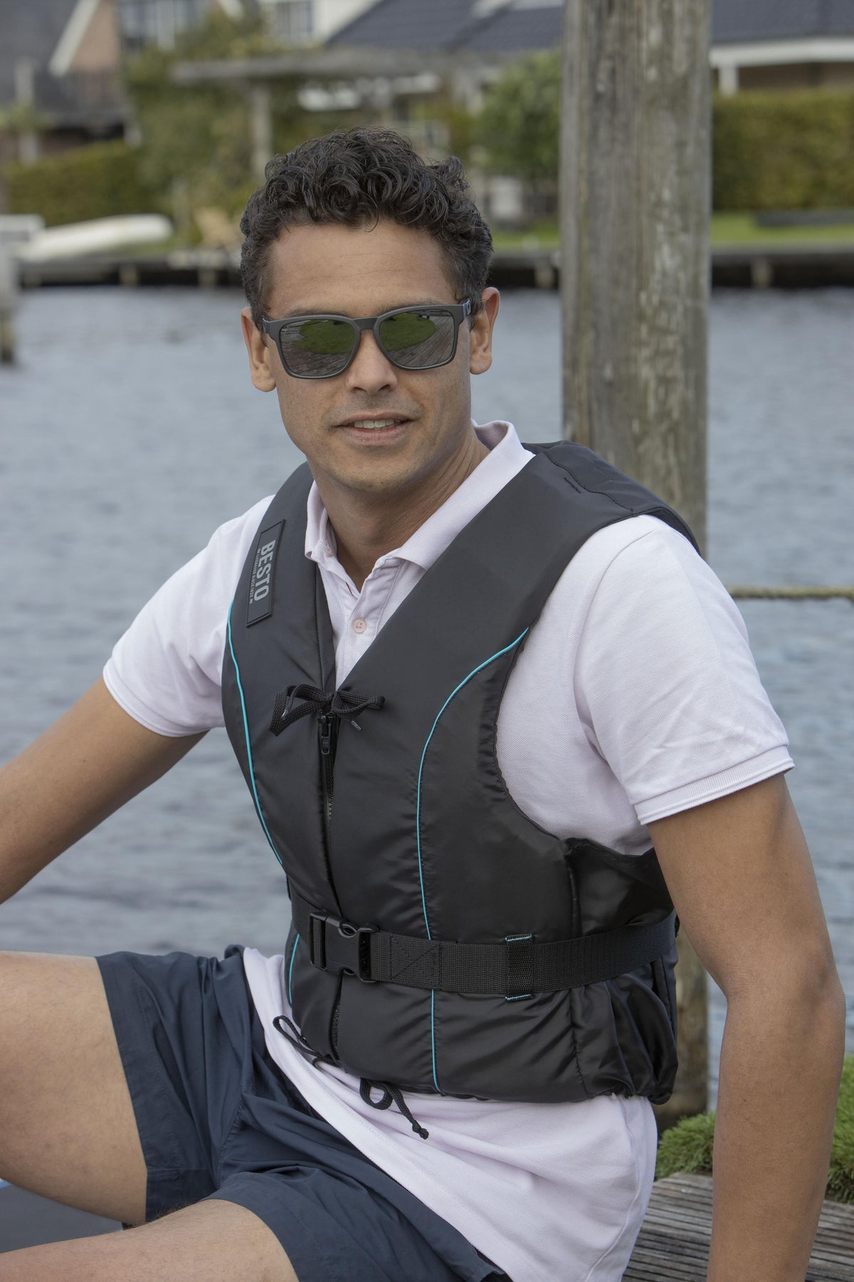 Besto Dinghy Zipper drijfvest zwart met aqua strepen 50 N maat L
